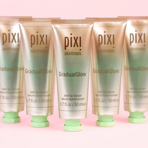 Pixi GradualGlow Self-Tan Serum in a row on pink background