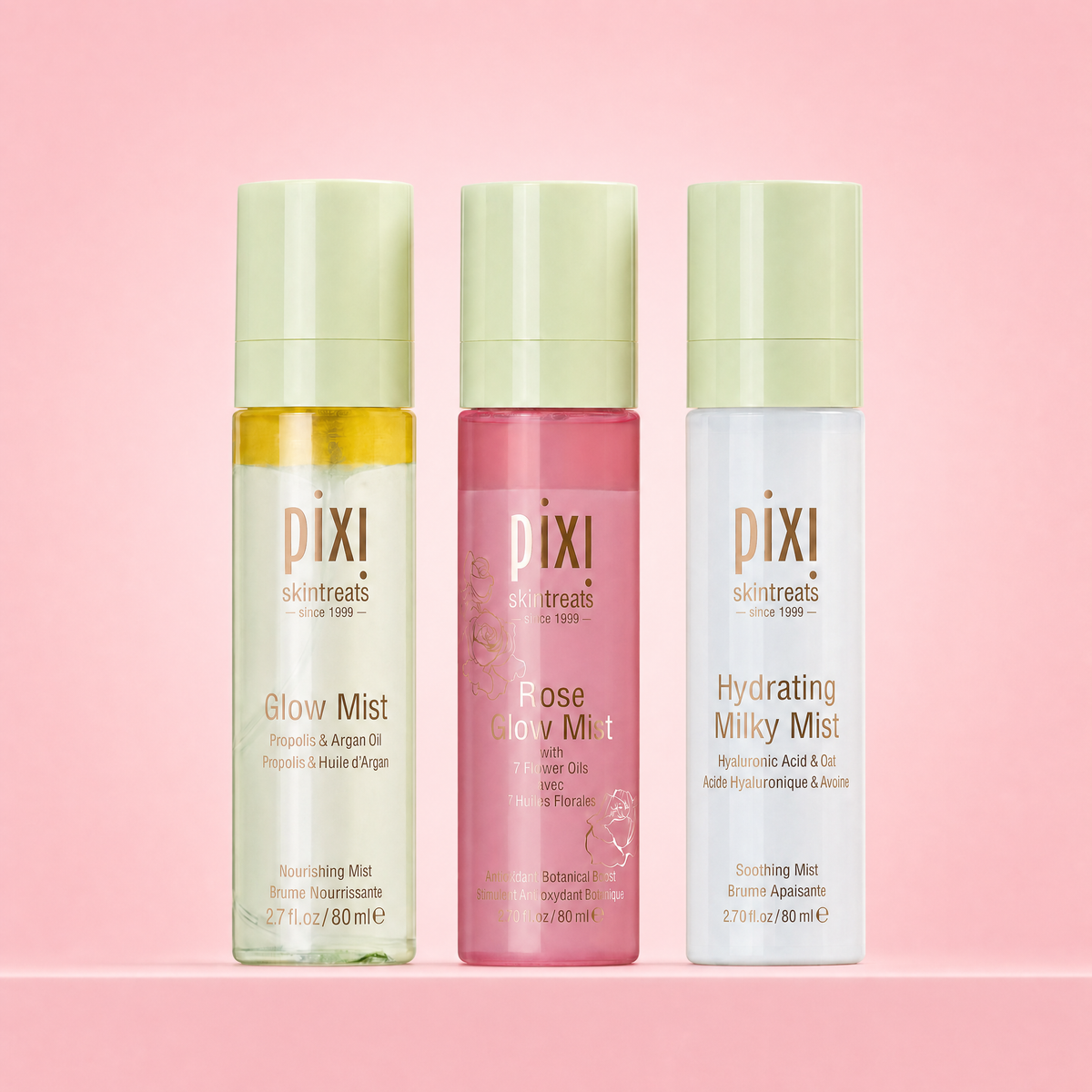 Misting Must-Haves Trio shown on a pink background featuring Glow Mist, Rose Glow Mist and Hydrating Milky Mist